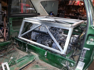 The engine cover build in process. The front panel tips outward for access.